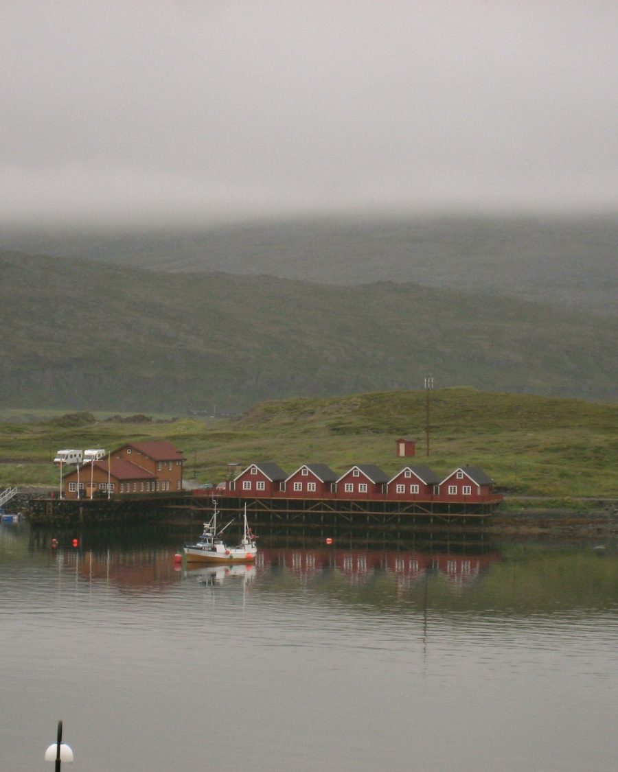 Overcast fishing harbor town, an anime-production key-art reference